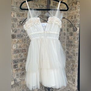 Mable cream tiered dress with V neck and floral embellishments, size small.
